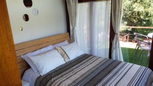 Postel nebo postele na pokoji v ubytování Casa en el Árbol + 13 fotografií
