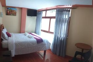 Cama ou camas em um quarto em Machupicchu Lodging