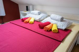 a group of four pillows sitting on a bed at Cro Behar 2 Apartments in Sveti Petar