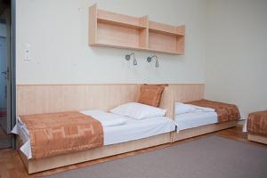 Postel nebo postele na pokoji v ubytování Hotel Kerpely