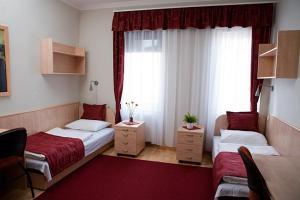 Postel nebo postele na pokoji v ubytování Hotel Kerpely