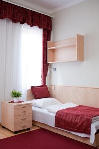 Postel nebo postele na pokoji v ubytování Hotel Kerpely