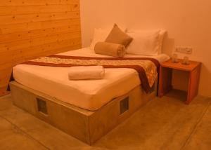 Voodi või voodid majutusasutuse Trinco Relax Hut toas