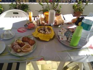 a table with plates of food on top of it at La Castellese in Aci Castello