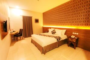 Llit o llits en una habitació de Grand Amira Hotel