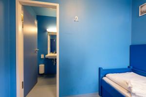 Ein Bett oder Betten in einem Zimmer der Unterkunft Jugendherberge Oberammergau