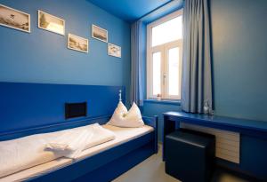 Ein Bett oder Betten in einem Zimmer der Unterkunft Jugendherberge Oberammergau