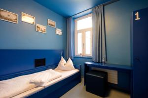 Ein Bett oder Betten in einem Zimmer der Unterkunft Jugendherberge Oberammergau