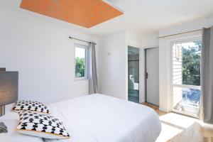 Postel nebo postele na pokoji v ubytování Villa Des Dunes