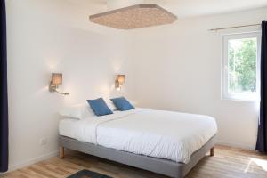 Postel nebo postele na pokoji v ubytování Villa Des Dunes