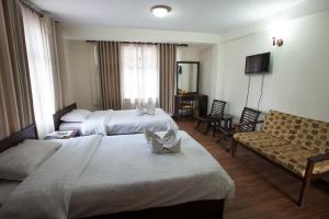 Ένα ή περισσότερα κρεβάτια σε δωμάτιο στο Hotel Yambu kathmandu