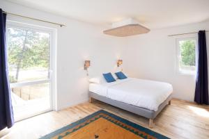 Postel nebo postele na pokoji v ubytování Villa Des Dunes
