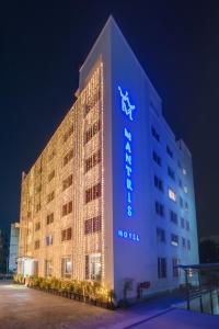 a hotel with a sign on the side of it at Mantris Hotel in Visakhapatnam