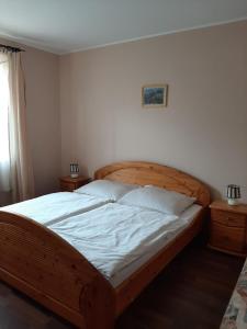 Posteľ alebo postele v izbe v ubytovaní Aqua Line Apartmanház