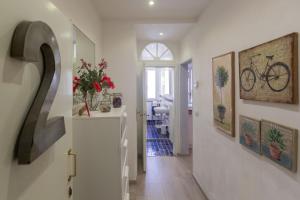 a hallway with a bike hanging on the wall at Piazza del Mercato Centrale in Florence