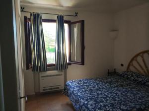 A bed or beds in a room at Residence La Conia