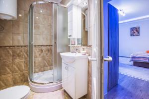 Koupelna v ubytování Belien Apartman + 37 fotografií