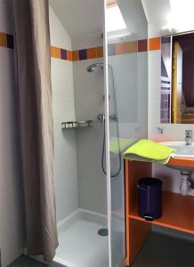 a bathroom with a shower and a sink at La Brise de Mer in Saint-Michel-Chef-Chef