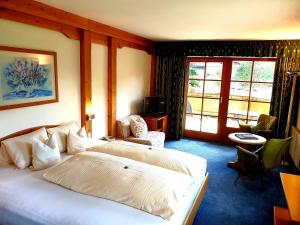 Postel nebo postele na pokoji v ubytování Hotel Alpin