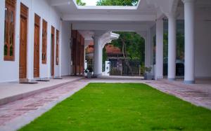 A garden outside MRD Beach Hotel