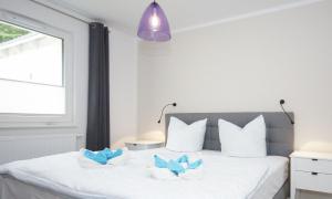 Ein Bett oder Betten in einem Zimmer der Unterkunft Ferienwohnung Windherz