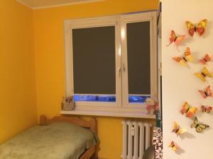 Posteľ alebo postele v izbe v ubytovaní Wyjątkowy apartament w sercu Piły