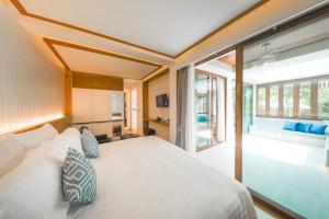 Postel nebo postele na pokoji v ubytování Kundala Beach Resort Hua Hin