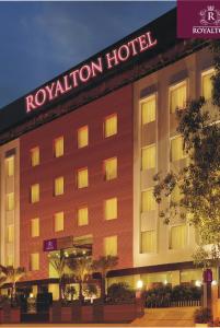 a hotel with a sign on the front of it at Royalton Hyderabad Abids in Hyderabad