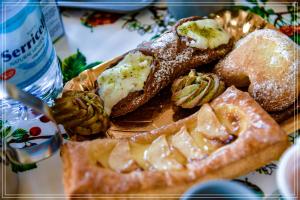 a plate of food with bread and other foods at B&B Sicily in Porto Empedocle