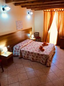 a bedroom with a bed and a table and chairs at La marina in Cagliari