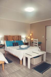 Un pat sau paturi într-o cameră la LA CASETTA BED & BREAKFAST