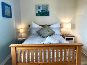 Ένα ή περισσότερα κρεβάτια σε δωμάτιο στο Sea Breeze
