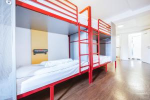a bunk bed in a room with wooden floors at YHA Liverpool Central in Liverpool