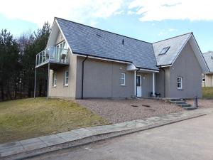 a house with a balcony on the side of it at Inchmarlo Golf Resort, Banchory Villa 26 AS 00266F in Banchory