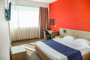 Postel nebo postele na pokoji v ubytování Hotel Putnik