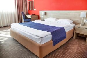 Postel nebo postele na pokoji v ubytování Hotel Putnik