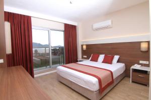 Postel nebo postele na pokoji v ubytování Sunway Club Otel