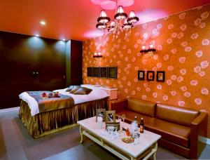 a hotel room with a bed and a couch at Hotel Christmas Night at the Opera (Love Hotel) in Nishihara