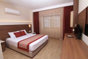 Postel nebo postele na pokoji v ubytování Sunway Club Otel