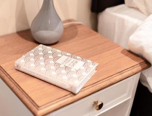 a wooden table with a tray on top of a nightstand at A Stay On The Brae in Edinburgh