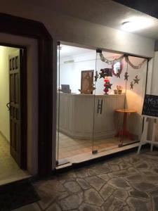 an entrance to a room with a glass doorway at Cerro del sol, habitaciones privadas in Salta