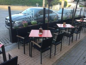 a row of tables and chairs at a restaurant at Hotel Castillo in Palma del Río