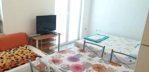 Postel nebo postele na pokoji v ubytování Apartments Vila Lavanda