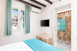 TV a/nebo společenská místnost v ubytování Monza House Otel