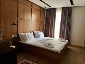 מיטה או מיטות בחדר ב-Hotel Lahuta
