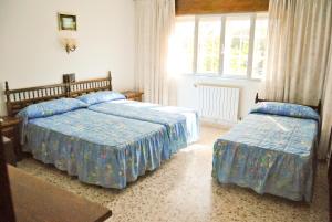 Posteľ alebo postele v izbe v ubytovaní Hotel Maruxa