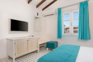 TV a/nebo společenská místnost v ubytování Monza House Otel