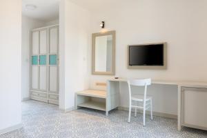 TV a/nebo společenská místnost v ubytování Monza House Otel