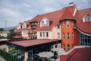 a large building with a red roof at V&P HOTEL & Restaurant in Khust