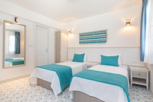 Postel nebo postele na pokoji v ubytování Monza House Otel